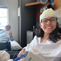 Jammie-Lee smiling with her mum post epilepsy surgery at Austin Health